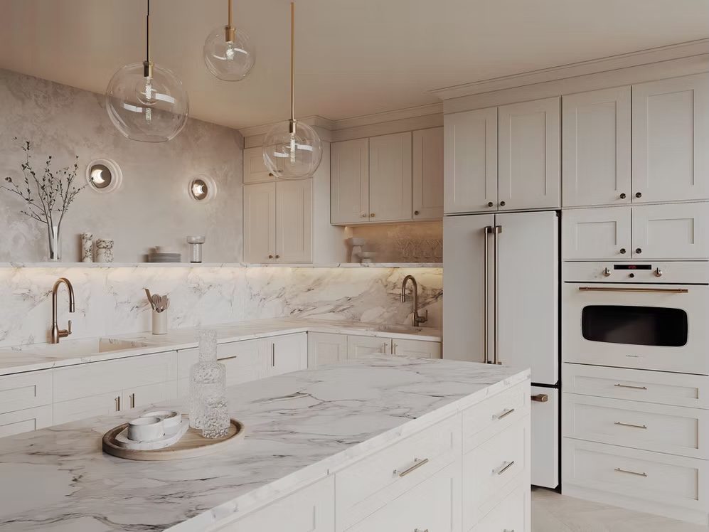 White shaker kitchen cabinets with marble backsplash from the Forevermark line carried by Division Seven Millwork