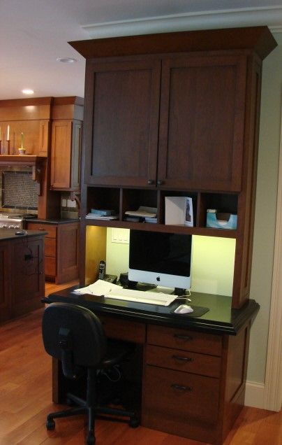 Stained wood built-in desk with hutch and task lighting built by Division Seven Millwork