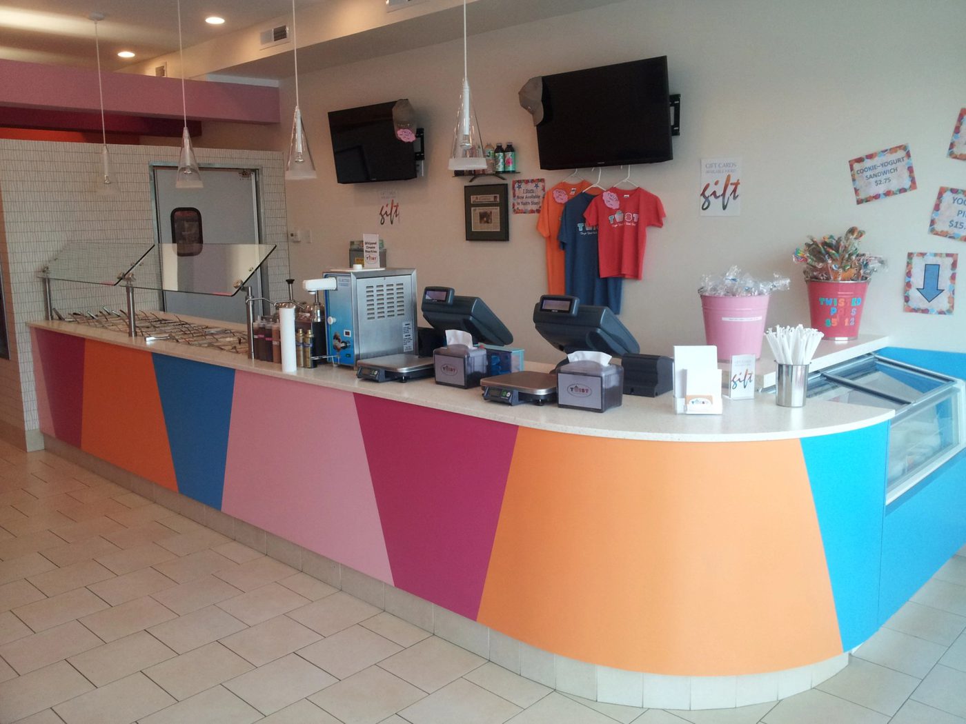 Custom colorful retail service counter and casework built by Division Seven Millwork